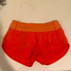 ORANGE LULULEMON SPEED UPS LOW RISE 2.5 IN